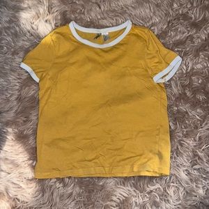 A bright yellow shirt from H&M with white outline